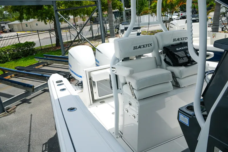 Slide: The Image of 2019 Blackfin 272 CC boat with dual Yamaha engines and cushioned seating. - 24