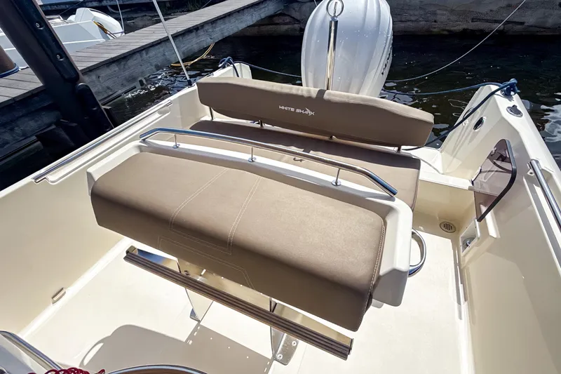 Slide: The Image of 2023 White Shark 230CC boat interior with beige seating and sleek design. - 12