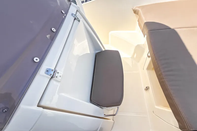 Slide: The Image of 2023 White Shark 230CC boat interior with cushioned seating and sleek design. - 5
