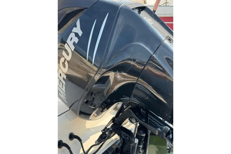 Slide: The Image of 2017 Scout 215 XSF boat with Mercury outboard engine, close-up view. - 14