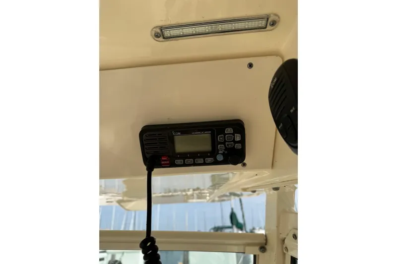 Slide: The Image of 2017 Scout 215 XSF boat interior with mounted radio equipment. - 10