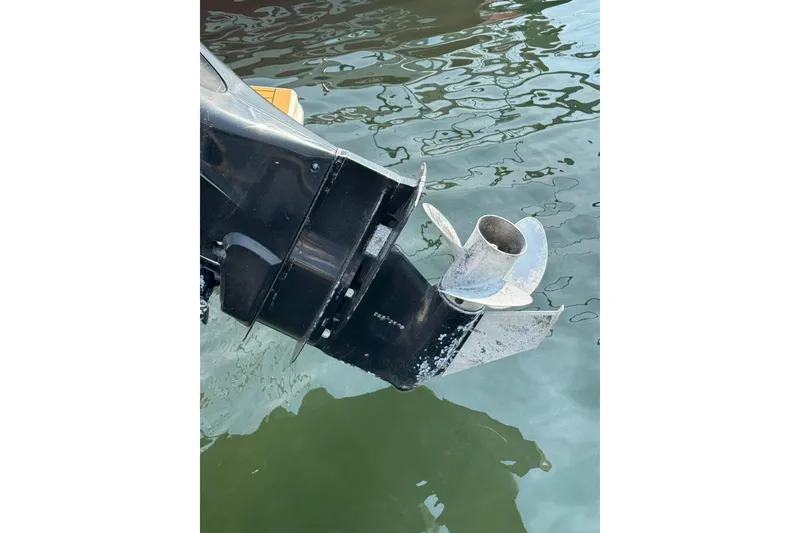 Slide: The Image of Outboard motor propeller of a 2017 Scout 215 XSF boat in water. - 16