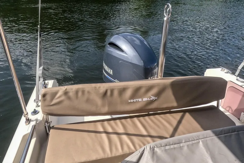 Slide: The Image of 2023 White Shark 210CC boat with Yamaha engine on calm water. - 9