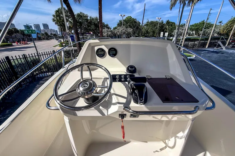 Slide: The Image of Helm of a 2023 White Shark 210CC with steering wheel and instruments. - 6