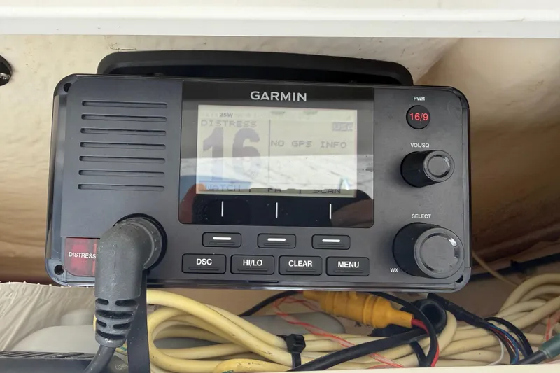 Slide: The Image of Garmin marine radio on 2018 Robalo 246 Cayman, displaying distress channel settings. - 33