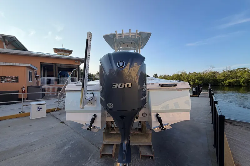 Slide: The Image of 2018 Robalo 246 Cayman boat with Yamaha 300 engine at dockside. - 6