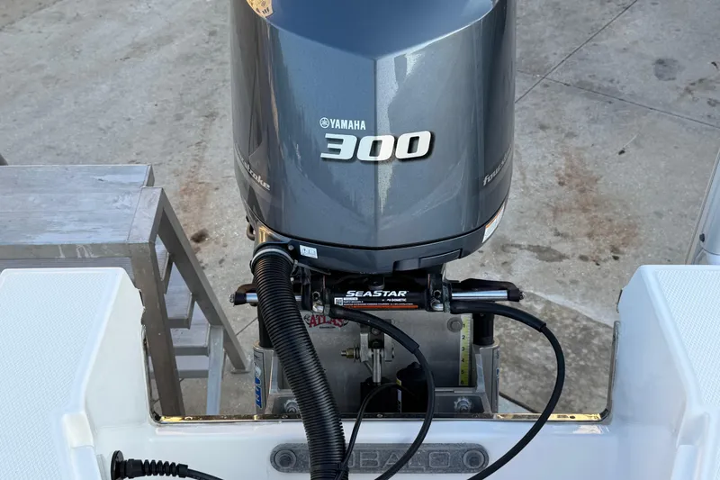Slide: The Image of 2018 Robalo 246 Cayman with Yamaha 300 outboard engine, featuring SeaStar hydraulic steering. - 28