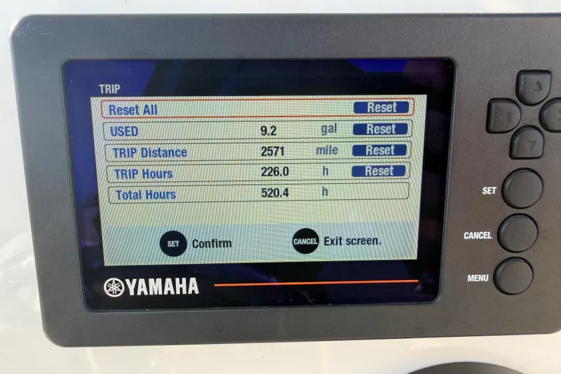Slide: The Image of Yamaha display showing trip data: 9.2 gallons used, 2571 miles, 226 hours, 520.4 total hours. - 32