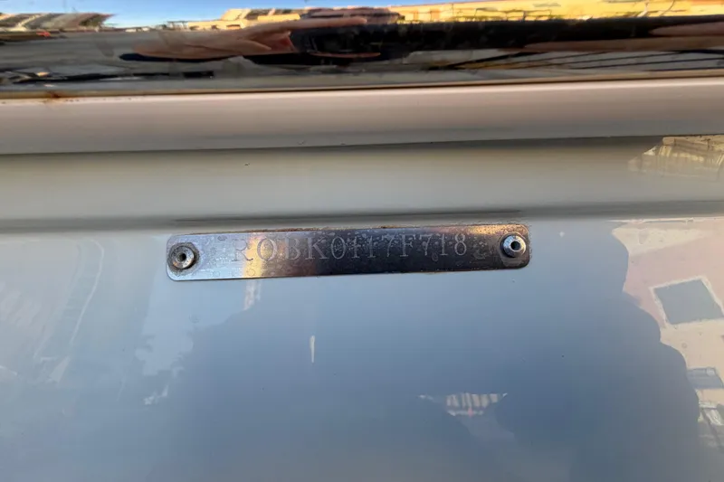 Slide: The Image of 2018 Robalo 246 Cayman boat identification plate with engraved serial number. - 39