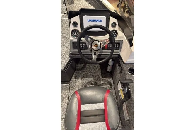 Slide: The Image of 2026 Ranger VS1682SC Angler boat cockpit with Lowrance display and steering wheel. - 4