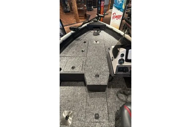 Slide: The Image of 2026 Ranger VS1682SC Angler boat interior with gray carpet and control panel. - 8