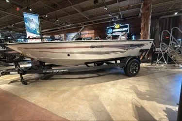 The Image of 2026 Ranger VS1682SC Angler boat displayed indoors on a trailer. - 0