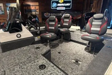 Slide: The Image of 2026 Ranger VS1682SC Angler boat interior with three seats and carpeted deck. - 2