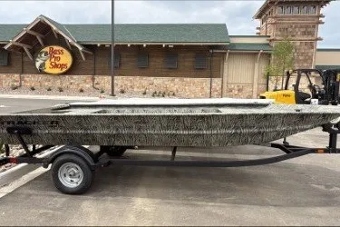 The Image of 2026 Tracker Grizzly 1860 Utility boat outside Bass Pro Shops. - 0