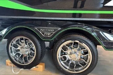 Slide: The Image of 2026 Nitro ZV21 Pro trailer with dual chrome wheels and sleek green accents. - 5