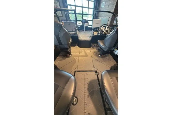 Slide: The Image of Interior of 2026 Nitro ZV21 Pro boat with modern seating and dashboard. - 2