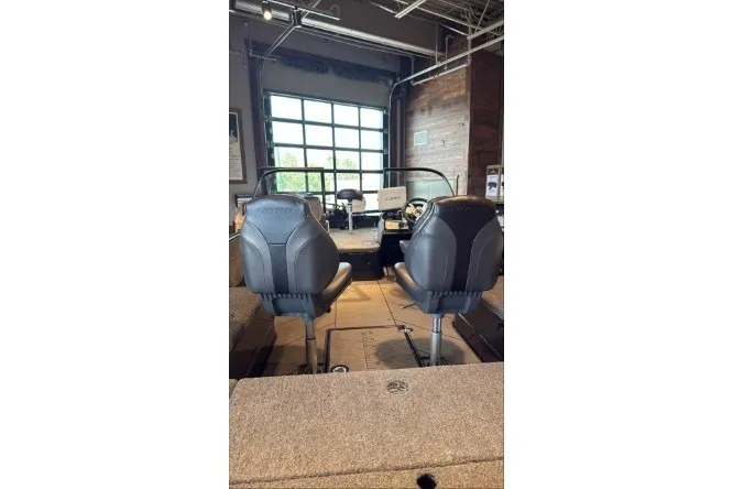 Slide: The Image of 2026 Nitro ZV21 Pro boat interior with two black seats in a showroom. - 1