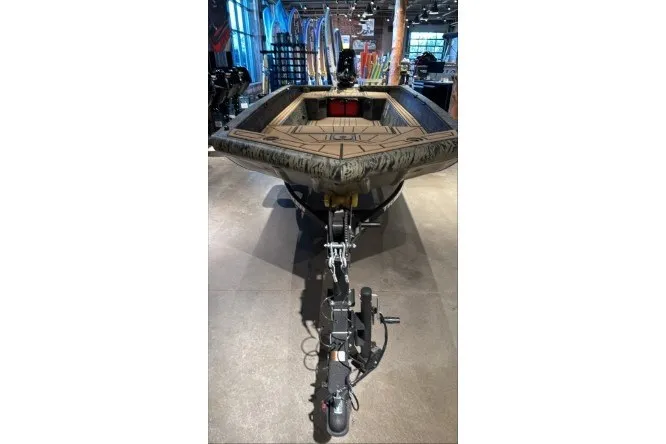 The Image of 2026 Tracker Grizzly 1650 T Prairie Wings Edition boat on display in showroom. - 0