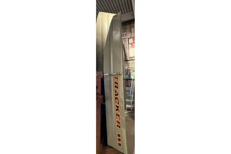 The Image of 2026 Tracker Grizzly 10 Jon boat displayed vertically in a showroom. - 0