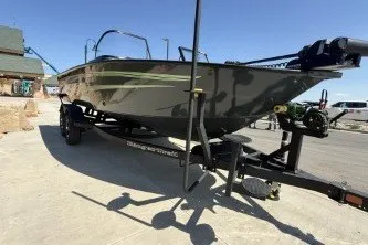 The Image of 2026 Ranger VX1888 WT boat on trailer, parked outdoors under clear blue sky. - 0