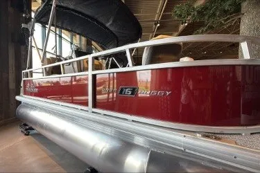 The Image of 2026 Sun Tracker Bass Buggy 16 XL Select pontoon boat in showroom. - 0