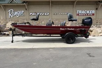 The Image of 2026 Tracker Bass Tracker Classic XL boat on trailer, parked outside dealership. - 0