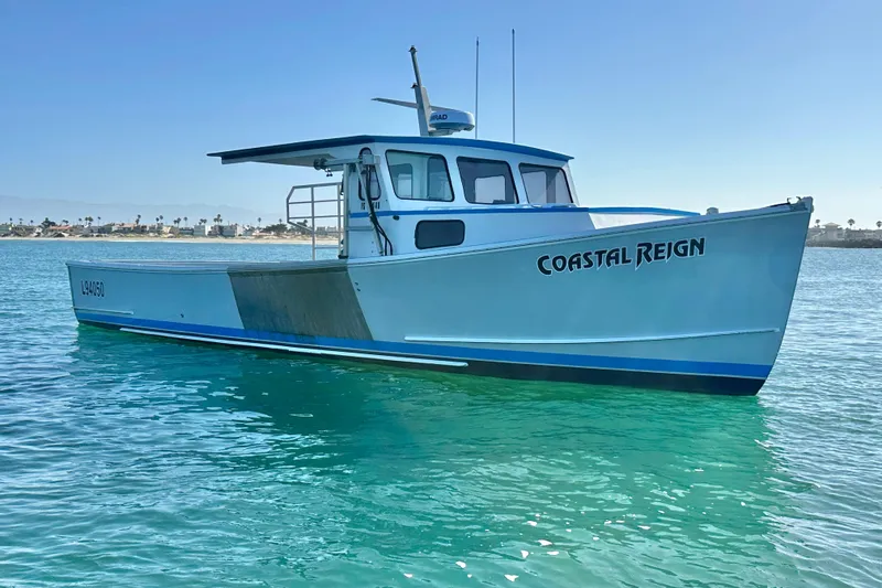 The Image of 2016 Libby Downeast boat "Coastal Reign" on clear blue water. - 0