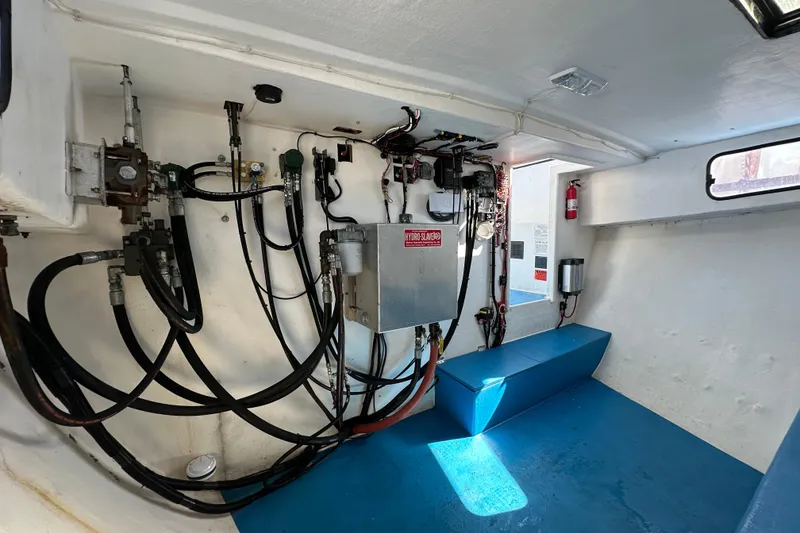 Slide: The Image of Interior of a 2016 Libby Downeast boat showing hydraulic systems and seating. - 14