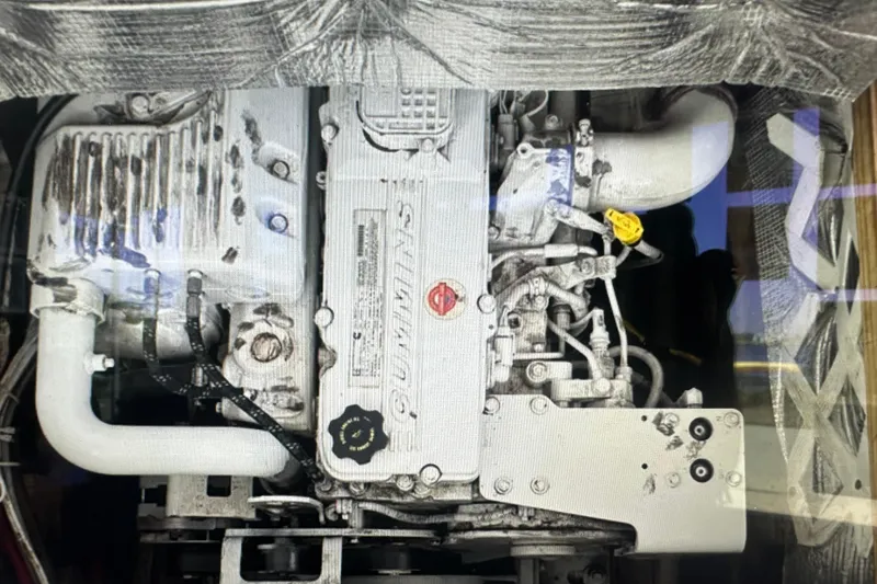 Slide: The Image of Cummins engine in a 2016 Libby Downeast boat, showcasing mechanical components. - 10