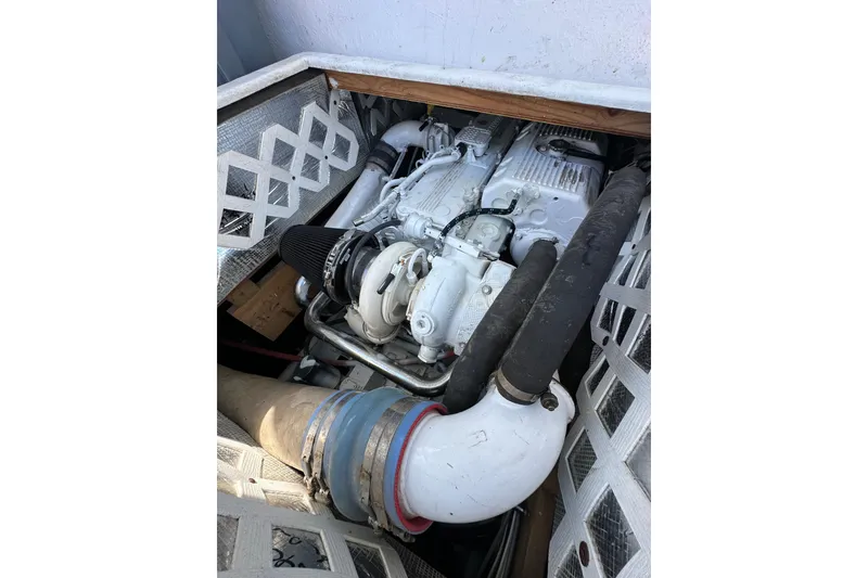 Slide: The Image of Engine compartment of a 2016 Libby Downeast boat, showcasing mechanical components. - 11