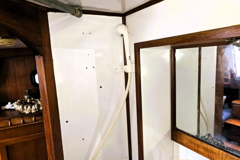 Slide: The Image of 1978 CHB 34 trawler interior with wooden trim and mirror. - 20