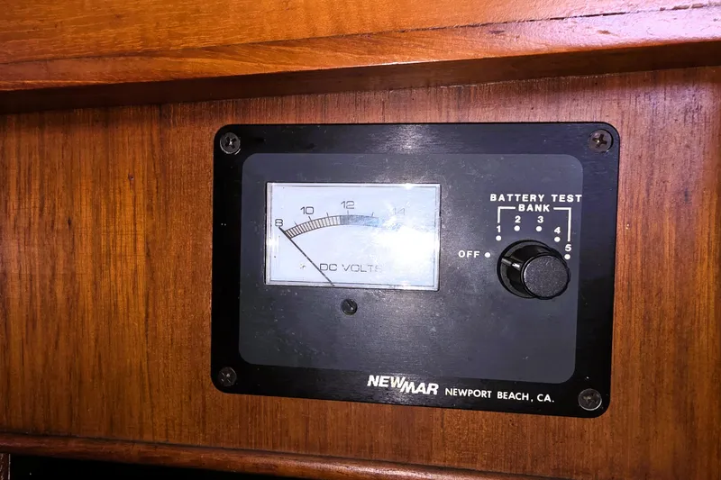 Slide: The Image of Battery test panel on 1978 CHB 34 trawler, featuring DC volts gauge and selector knob. - 33