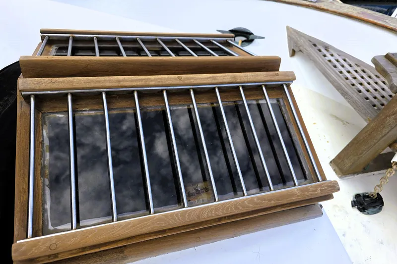Slide: The Image of Wooden hatch with metal bars on a 1978 CHB 34 trawler boat deck. - 22