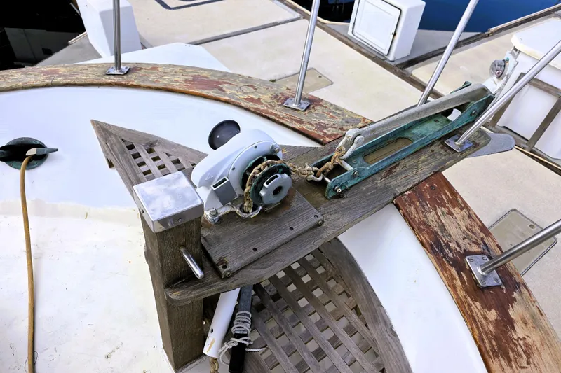 Slide: The Image of 1978 CHB 34 Trawler deck with winch and weathered wood details. - 21