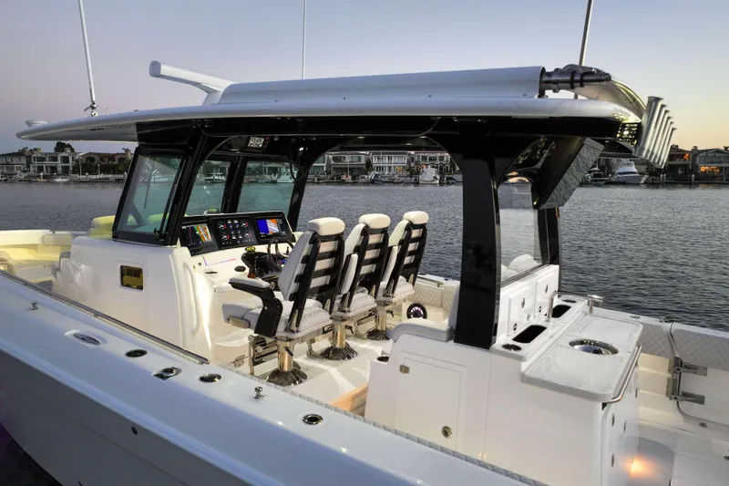 Slide: The Image of The image shows a modern boat with four cushioned seats and a sleek helm station. - 16