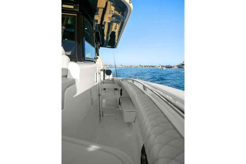Slide: The Image of A luxurious boat with cushioned seating and a clear view of the water. - 36