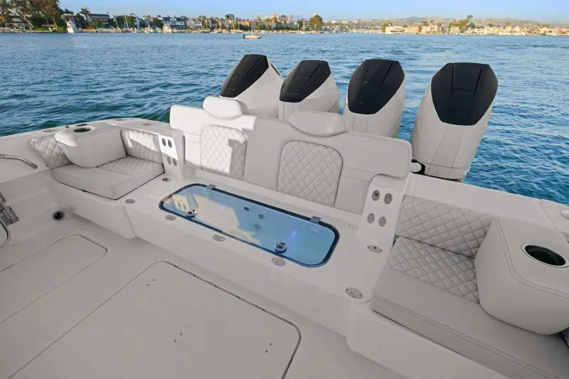 Slide: The Image of The image shows the cockpit of an HCB 42 Lujo boat with luxurious seating and four engines. - 39