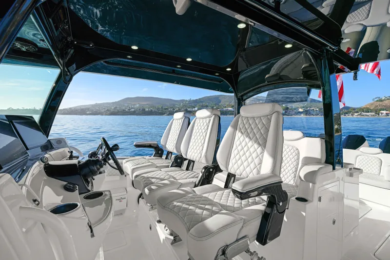 Slide: The Image of Luxurious interior of an HCB 42 Lujo with sleek, upholstered seats and a modern helm station. - 18