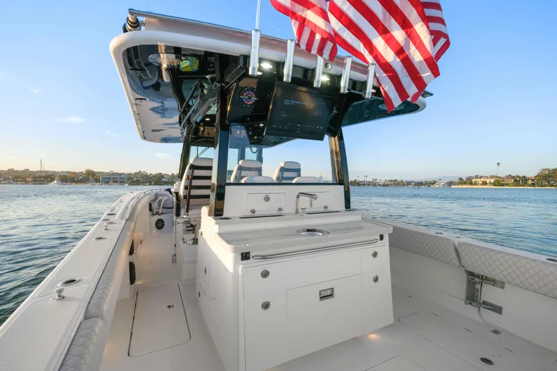 Slide: The Image of HCB 42 Lujo 2026: Luxurious boat with spacious deck and modern amenities, on calm water. - 45