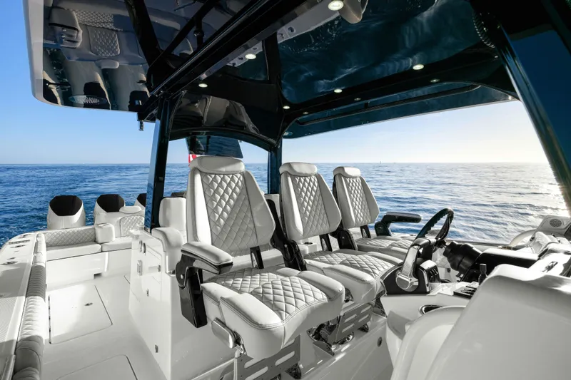 Slide: The Image of The image shows the cockpit of a 2026 HCB 42 Lujo with luxurious seating and ocean view. - 28