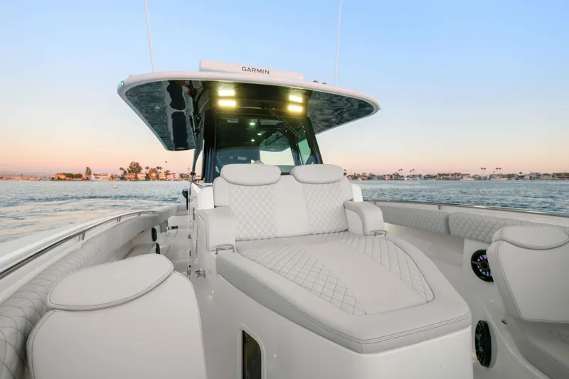 Slide: The Image of The image shows the deck of a 2026 HCB 42 Lujo boat with luxurious seating. - 48