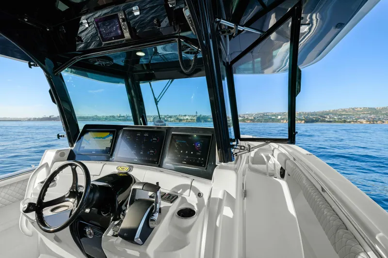 Slide: The Image of The cockpit of the 2026 HCB 42 Lujo features modern navigation systems and sleek design. - 25