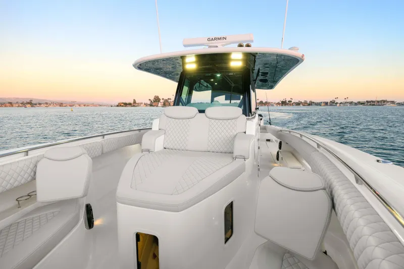 Slide: The Image of The image shows the deck of a 2026 HCB 42 Lujo with luxurious white seating. - 49
