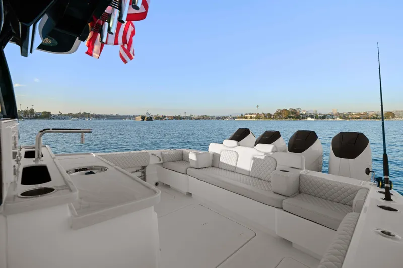 Slide: The Image of The image shows the spacious cockpit of a 2026 HCB 42 Lujo with luxurious seating and a view of the water. - 42