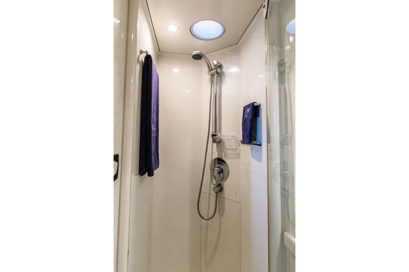 Slide: The Image of Shower area in 2004 Ta Chiao Custom Pilothouse Cutter, featuring modern fixtures and lighting. - 45