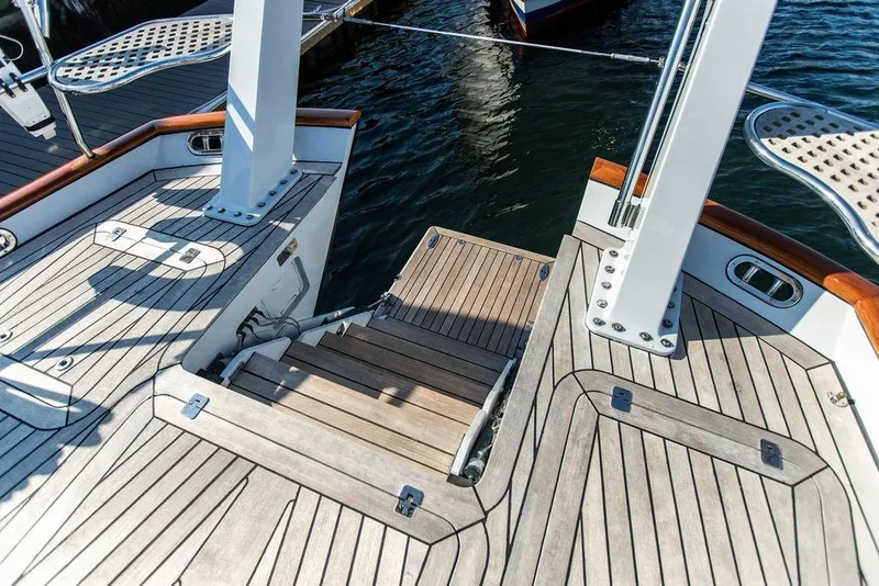 Slide: The Image of Deck of 2004 Ta Chiao Custom Pilothouse Cutter with wooden finish and metal fittings. - 16