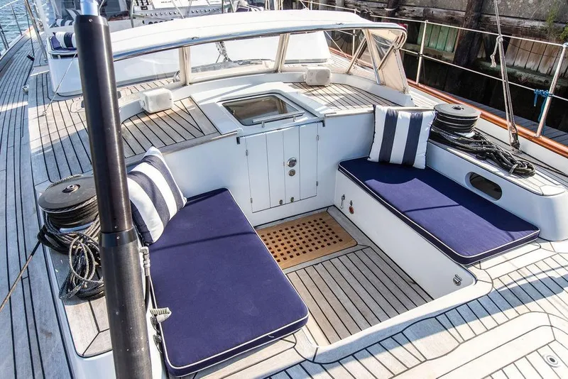 Slide: The Image of 2004 Ta Chiao Custom Pilothouse Cutter deck with seating and nautical decor. - 6