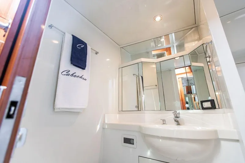 Slide: The Image of Luxurious bathroom in 2004 Ta Chiao Custom Pilothouse Cutter yacht, featuring elegant fixtures and mirrors. - 40