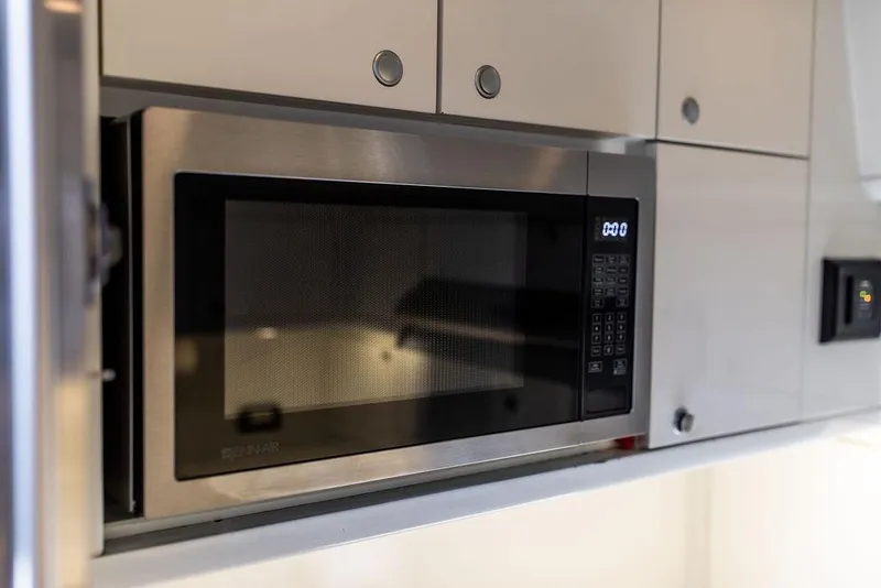 Slide: The Image of Built-in microwave in Ta Chiao Custom Pilothouse Cutter, 2004 model kitchen. - 53