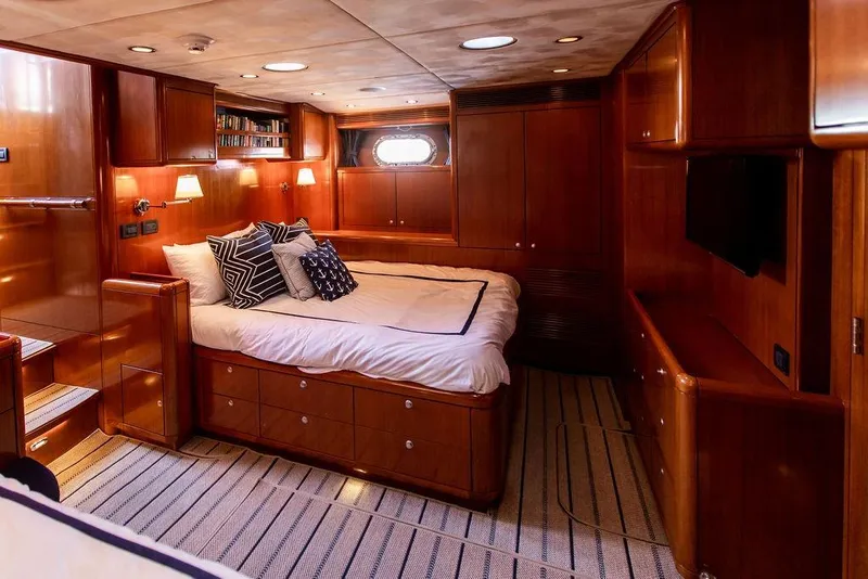 Slide: The Image of Luxurious 2004 Ta Chiao Custom Pilothouse Cutter cabin with wood paneling and cozy bedding. - 38